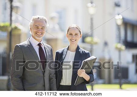 Business people smiling outdoors View Large Photo Image Stock Image - Business people smiling outdoors. Fotosearch