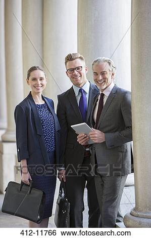Stock Photograph - Business people smiling outdoors. Fotosearch
