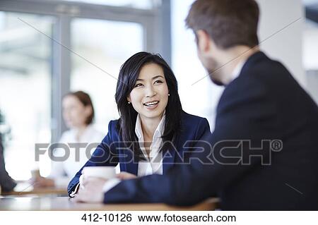 Business people talking in cafe View Large Photo Image Stock Photograph - Business people talking in cafe. Fotosearch