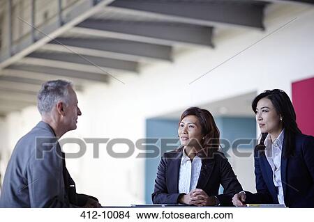 Business people talking in meeting View Large Photo Image Picture - Business people talking in meeting. Fotosearch