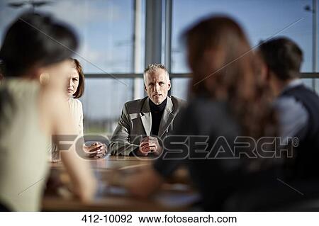 Business people talking in meeting View Large Photo Image Stock Image - Business people talking in meeting. Fotosearch