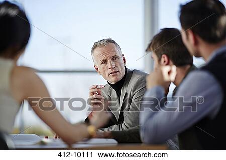 Business people talking in meeting View Large Photo Image Stock Image - Business people talking in meeting. Fotosearch