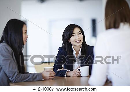Business people talking in meeting View Large Photo Image Stock Photo - Business people talking in meeting. Fotosearch