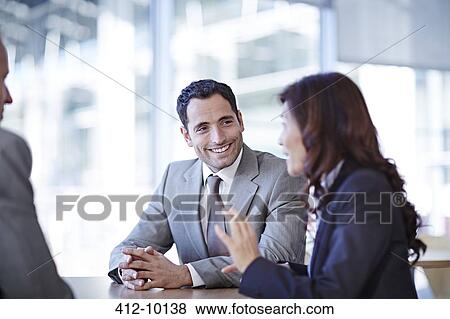 Business people talking in meeting View Large Photo Image Stock Photo - Business people talking in meeting. Fotosearch