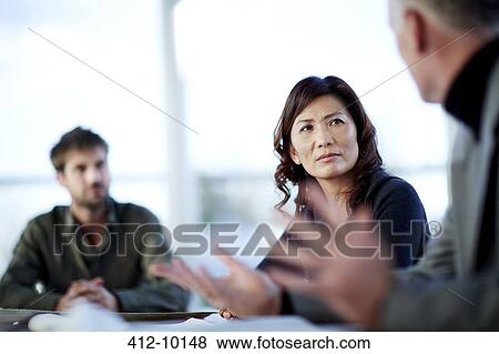 Business people talking in meeting View Large Photo Image Stock Photo - Business people talking in meeting. Fotosearch