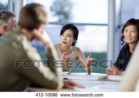 Business people talking in meeting View Large Photo Image Stock Photograph - Business people talking in meeting. Fotosearch