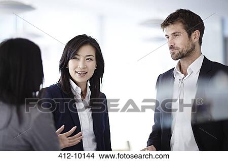 Business people talking in office View Large Photo Image Picture - Business people talking in office. Fotosearch