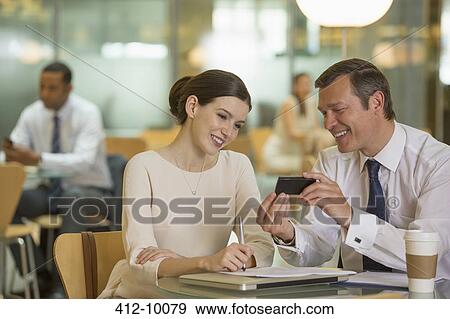 Business people talking in office View Large Photo Image Stock Photo - Business people talking in office. Fotosearch