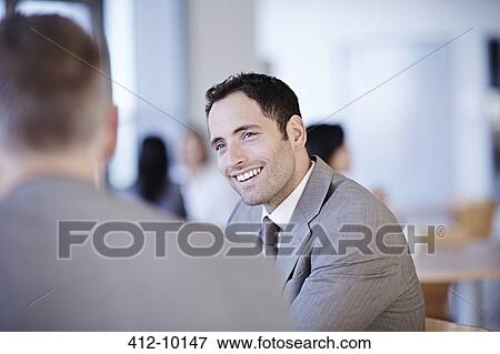 Business people talking in office View Large Photo Image Stock Photo - Business people talking in office. Fotosearch