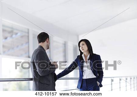 Business people talking in office View Large Photo Image Stock Photo - Business people talking in office. Fotosearch