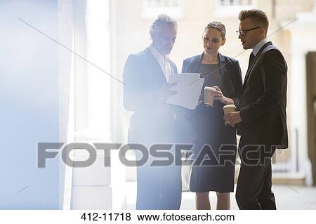 Business people talking in office View Large Photo Image Stock Photo - Business people talking in office. Fotosearch