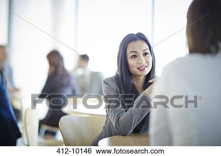 Business people talking in office View Large Photo Image Stock Photograph - Business people talking in office. Fotosearch
