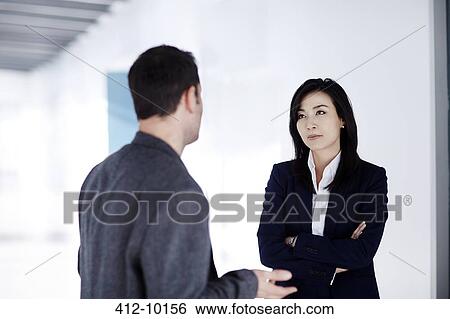 Business people talking in office View Large Photo Image Stock Photograph - Business people talking in office. Fotosearch