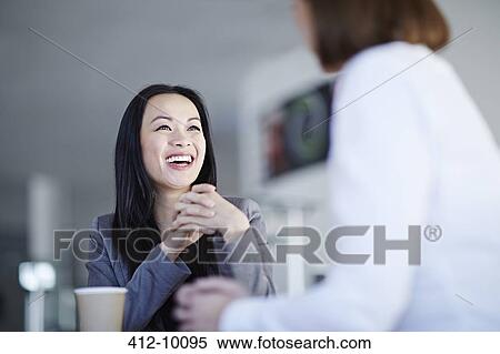 Business people talking in office View Large Photo Image Stock Photography - Business people talking in office. Fotosearch