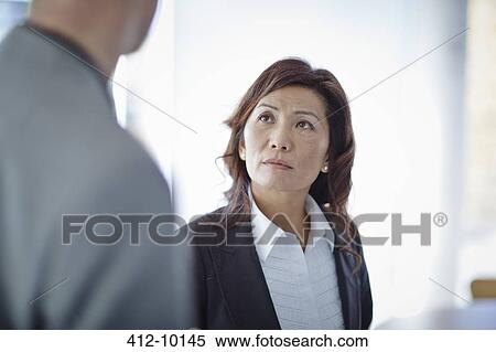 Business people talking in office View Large Photo Image Stock Photography - Business people talking in office. Fotosearch