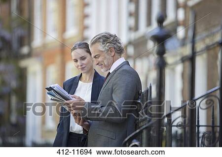 Business people talking outdoors View Large Photo Image Picture - Business people talking outdoors. Fotosearch