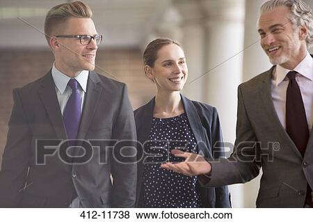 Business people talking outdoors View Large Photo Image Stock Photo - Business people talking outdoors. Fotosearch