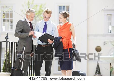 Business people talking outdoors View Large Photo Image Stock Photo - Business people talking outdoors. Fotosearch
