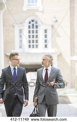 Businessmen talking outdoors View Large Photo Image Stock Photo - Businessmen talking outdoors. Fotosearch