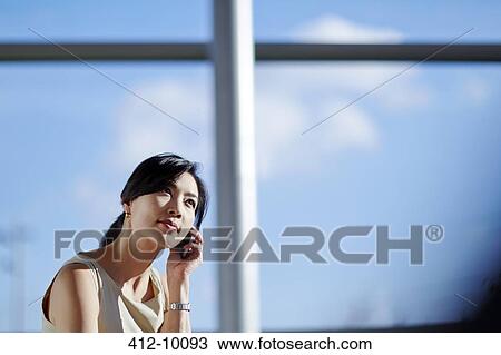 Businesswoman talking on cell phone View Large Photo Image Stock Image - Businesswoman talking on cell phone. Fotosearch