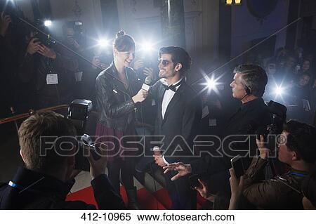 Stock Photography - Celebrity being interviewed on red carpet. Fotosearch