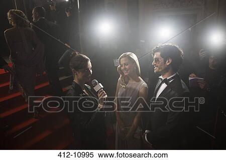 Celebrity couple being interviewed on red carpet View Large Photo Image Stock Photography - Celebrity couple being interviewed on red carpet. Fotosearch