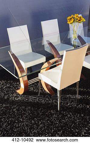 Chairs at modern dining table View Large Photo Image Stock Image - Chairs at modern dining table. Fotosearch