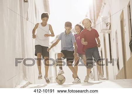 Children playing with soccer ball in alley View Large Photo Image Stock Image - Children playing with soccer ball in alley. Fotosearch