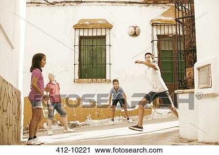 Children playing with soccer ball in alley View Large Photo Image Stock Image - Children playing with soccer ball in alley. Fotosearch