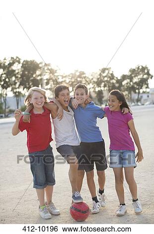 Children playing with soccer ball in sand View Large Photo Image Stock Photograph - Children playing with soccer ball in sand. Fotosearch
