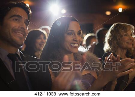 Stock Photo - Close up of clapping theater audience. Fotosearch