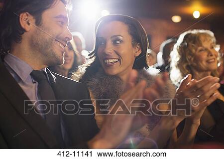 Close up of couple clapping in theater View Large Photo Image Stock Image - Close up of couple clapping in theater. Fotosearch