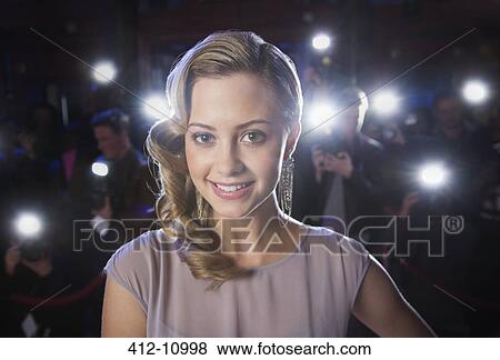 Close up portrait of smiling female celebrity with paparazzi in background View Large Photo Image Stock Photo - Close up portrait of smiling female celebrity with paparazzi in background. Fotosearch