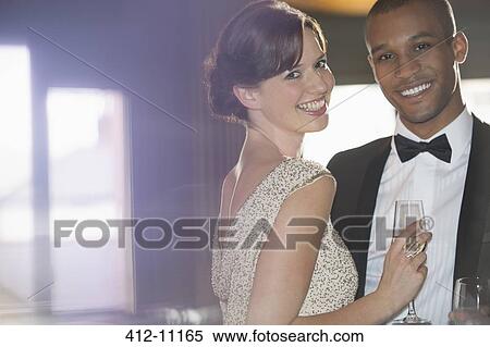 Close up portrait of well dressed couple smiling View Large Photo Image Stock Photography - Close up portrait of well dressed couple smiling. Fotosearch