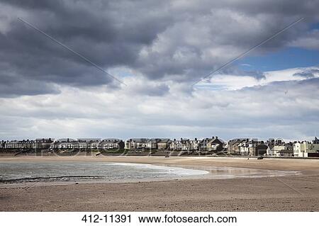 Clouds forming over coastal village View Large Photo Image Stock Image - Clouds forming over coastal village. Fotosearch