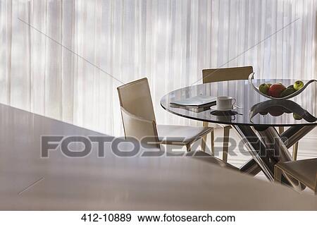 Coffee cup and newspaper on kitchen table View Large Photo Image Stock Photo - Coffee cup and newspaper on kitchen table. Fotosearch