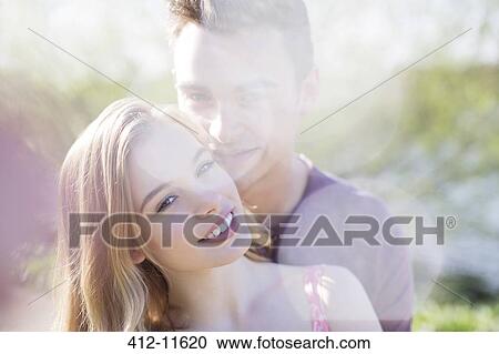 Couple hugging outdoors View Large Photo Image Stock Image - Couple hugging outdoors. Fotosearch