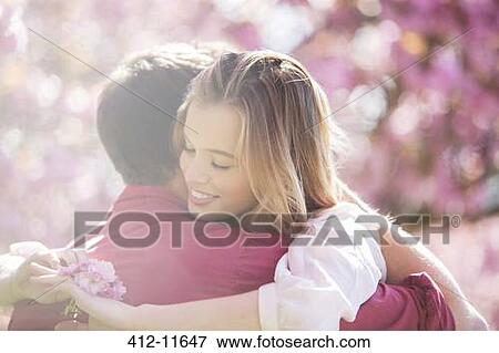 Couple hugging outdoors View Large Photo Image Stock Photo - Couple hugging outdoors. Fotosearch