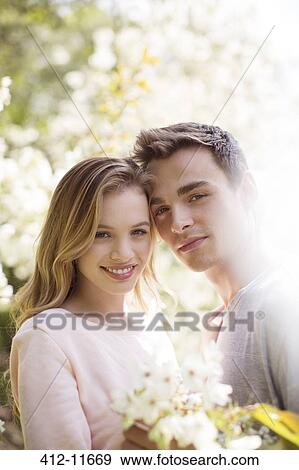 Couple hugging outdoors View Large Photo Image Stock Photo - Couple hugging outdoors. Fotosearch