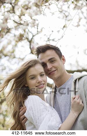 Couple hugging outdoors View Large Photo Image Stock Photography - Couple hugging outdoors. Fotosearch