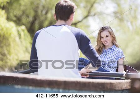 Couple in rowboat View Large Photo Image Stock Photography - Couple in rowboat. Fotosearch