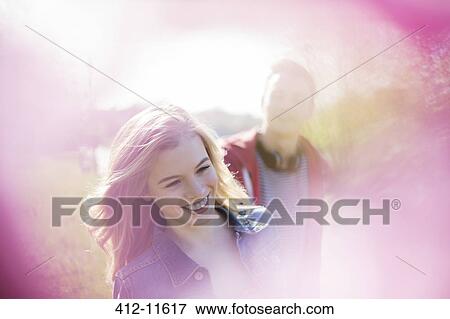 Couple smiling together outdoors View Large Photo Image Stock Photo - Couple smiling together outdoors. Fotosearch