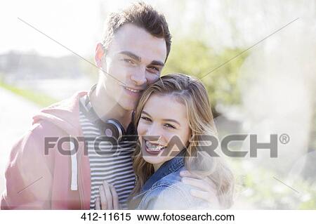Stock Photography - Couple smiling together outdoors. Fotosearch