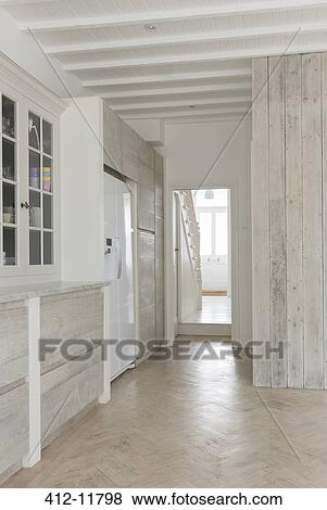 Stock Photo - Cupboards and refrigerator in kitchen. Fotosearch