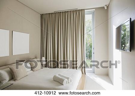 Curtains and bed in modern bedroom View Large Photo Image Stock Image - Curtains and bed in modern bedroom. Fotosearch