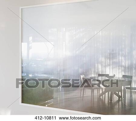 Dining table and chairs through window View Large Photo Image Stock Image - Dining table and chairs through window. Fotosearch