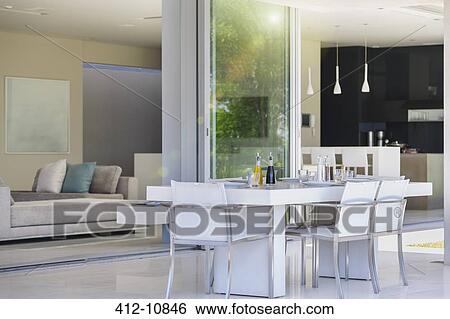 Dining table on modern patio View Large Photo Image Stock Photograph - Dining table on modern patio. Fotosearch