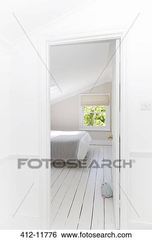 Doorway to whitewashed bedroom View Large Photo Image Stock Photograph - Doorway to whitewashed bedroom. Fotosearch