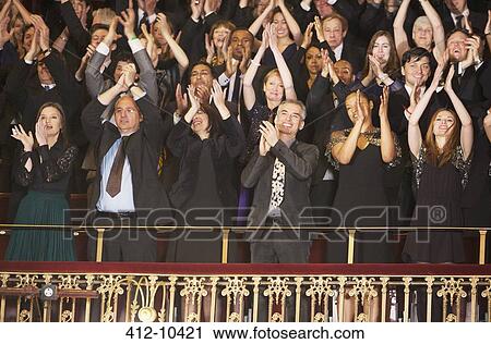Enthusiastic audience clapping in theater balcony View Large Photo Image Stock Image - Enthusiastic audience clapping in theater balcony. Fotosearch