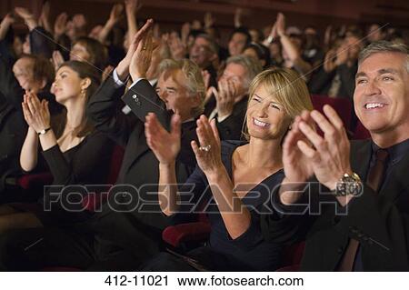 Enthusiastic audience clapping in theater View Large Photo Image Stock Image - Enthusiastic audience clapping in theater. Fotosearch